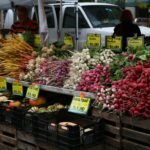 a bunch of vegetables are on display at a market